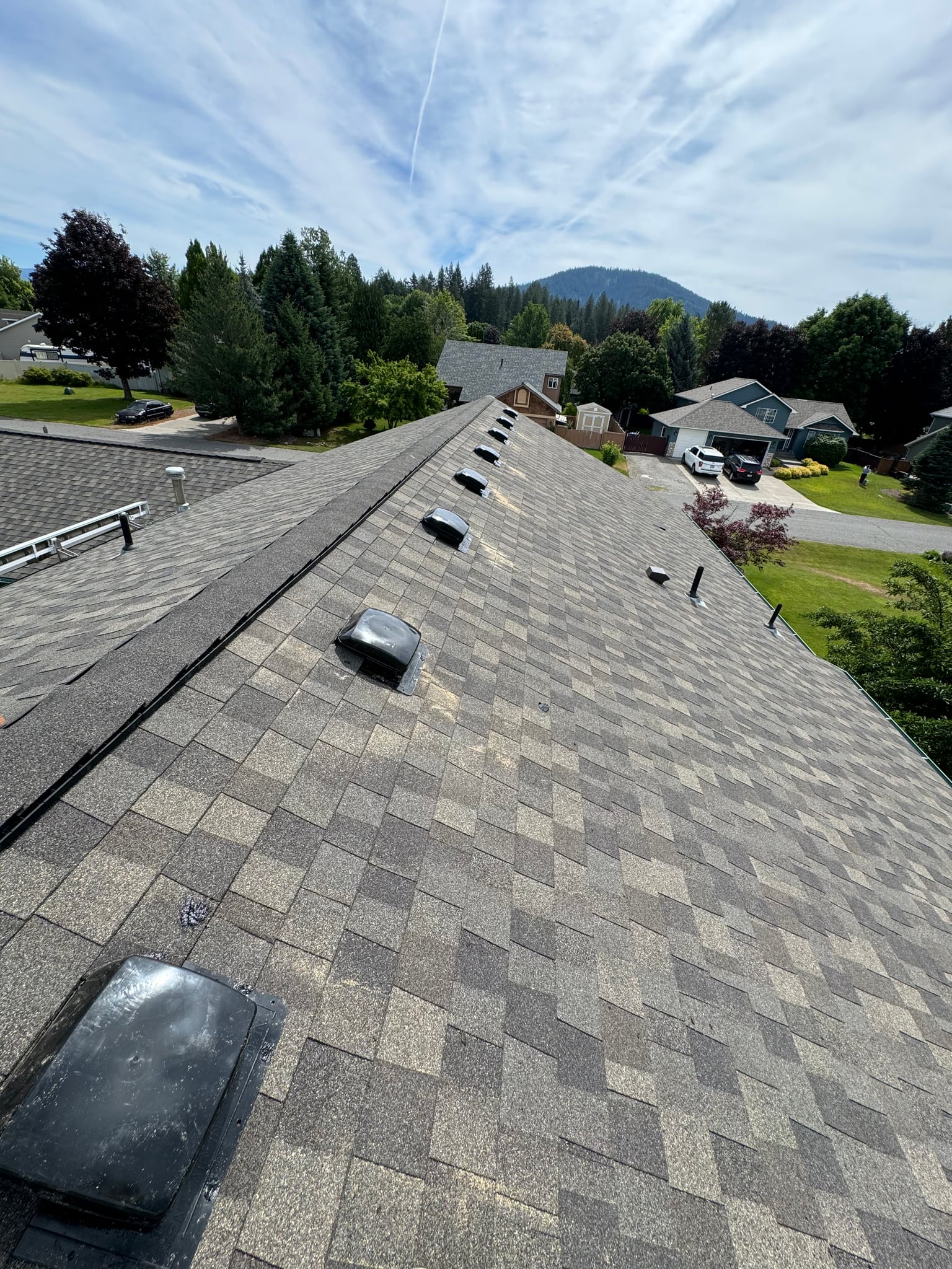 Shingle roof with multiple roof vents