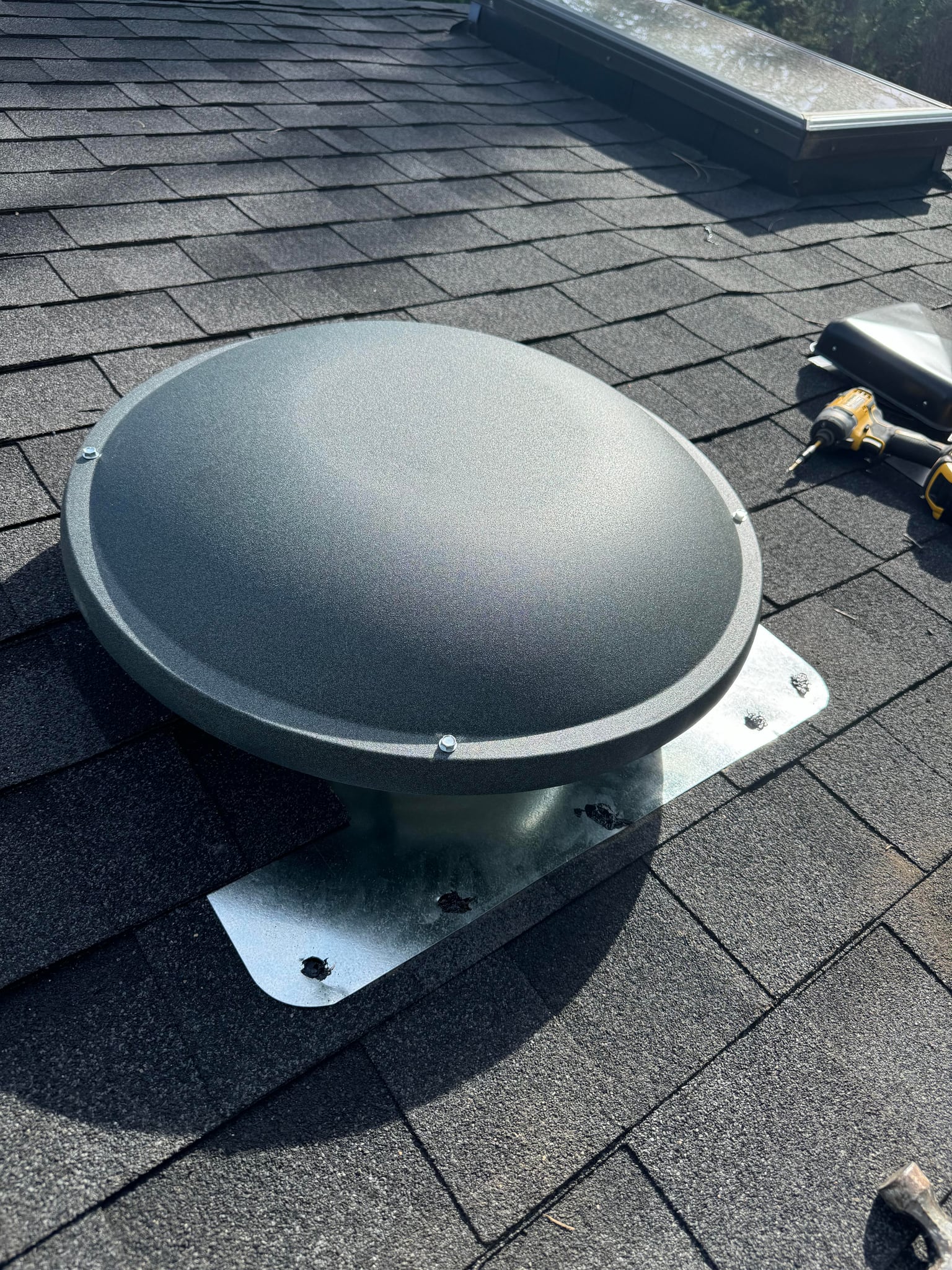 Close-up of a roof vent on a shingle roof